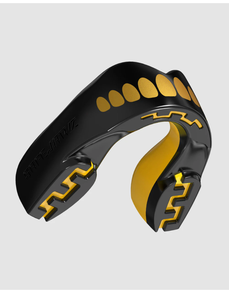 Protector bucal Safejawz Extro Series Goldie — diseño dorado brillante, doble capa y ajuste moldeable. Protección profesional.